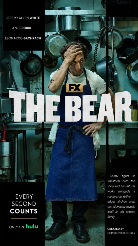 The Bear 2022 featured image showing Carmy working in a busy Chicago restaurant kitchen.
